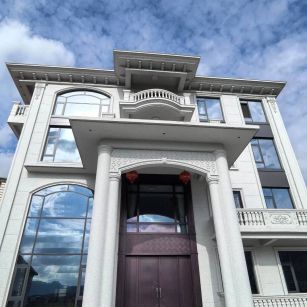 长春白麻别墅外墙干挂石材效果示例