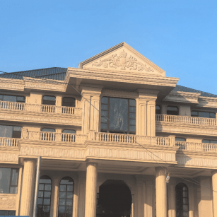 长春黄金麻别墅外墙干挂石材效果示例